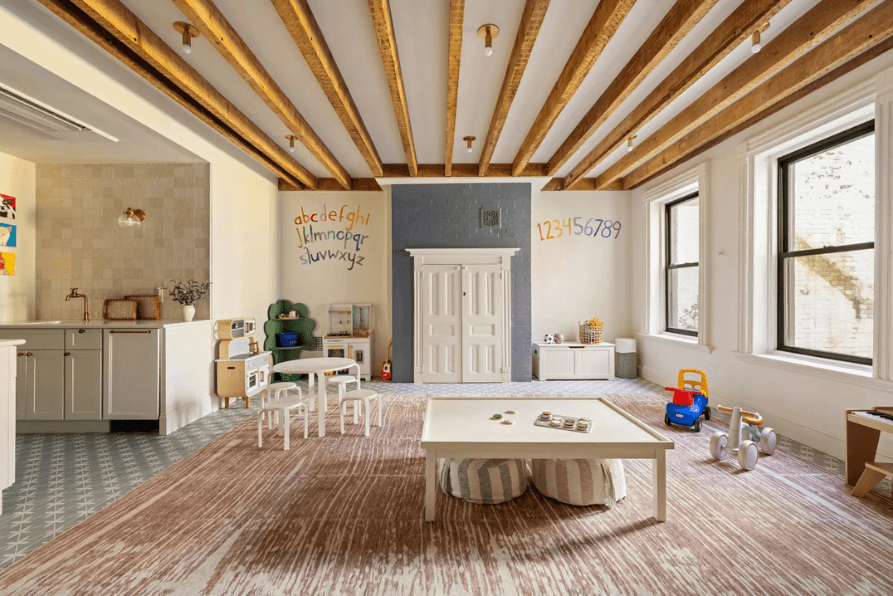 Renovated playroom with exposed wood beams