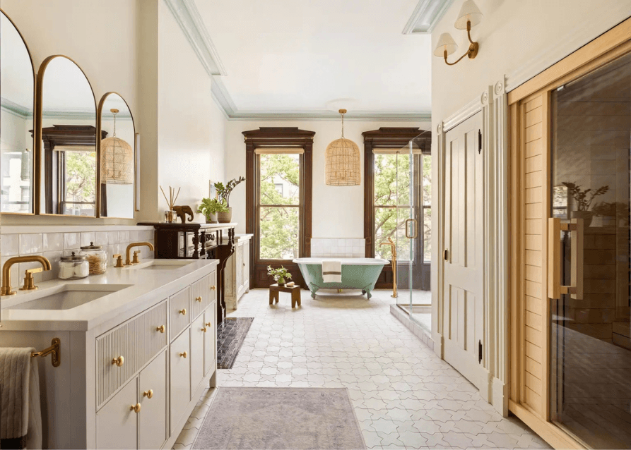 Bathroom renovation with clawfoot tub and wood-framed windows