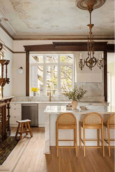 Renovated kitchen with marble island and wood beams