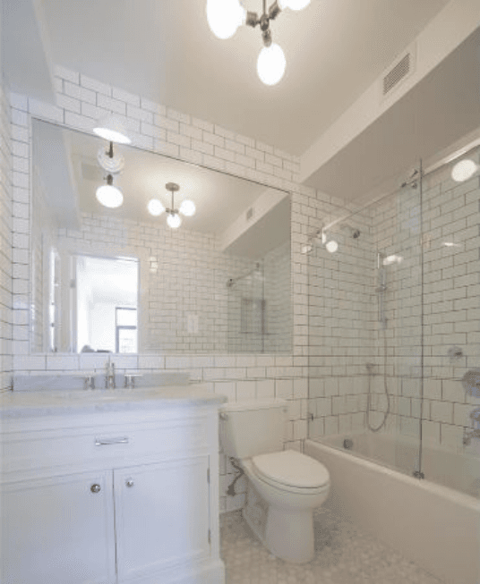 Bathroom with white subway tile and modern vanity